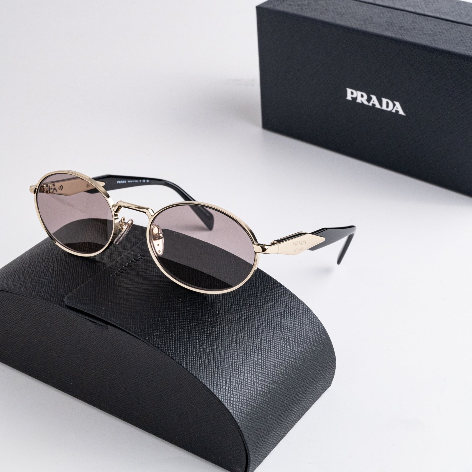 PRADA PR 65ZS ZVN20I PALE GOLD LIGHT PURPLE BROWN